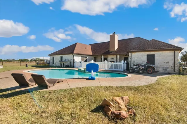 a patio with a table and chairs