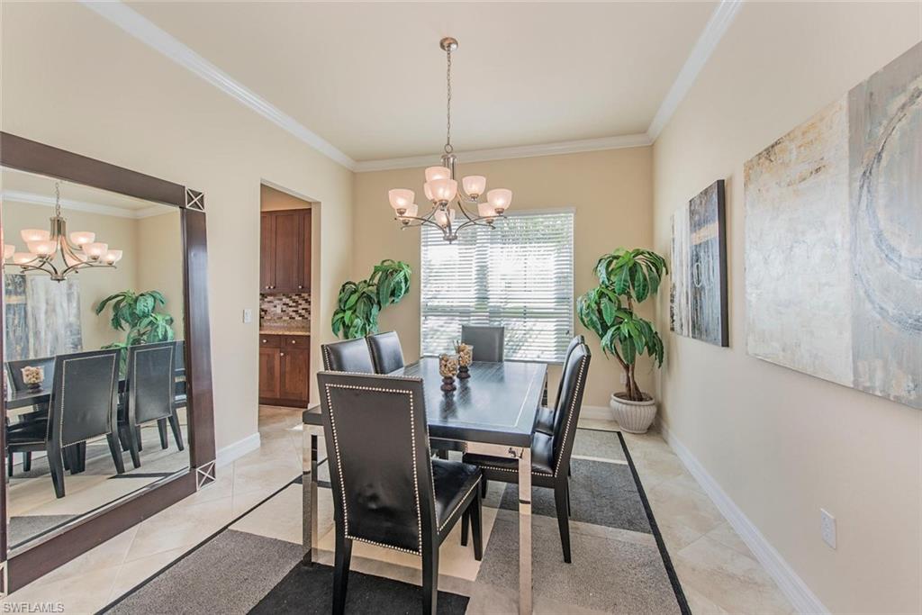 6559 Monterey Point Naples, FL 34105 - Photo 4 of 12 a view of a dining room with furniture window and wooden floor