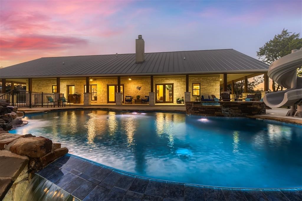837 Bell Springs Road Dripping Springs, TX 78620 - Photo 1 of 1 a view of a lake with houses