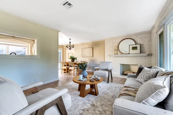 a living room with furniture and a fireplace