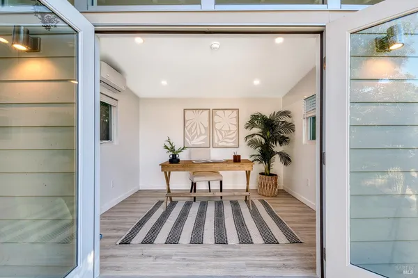 a living room with furniture and a window