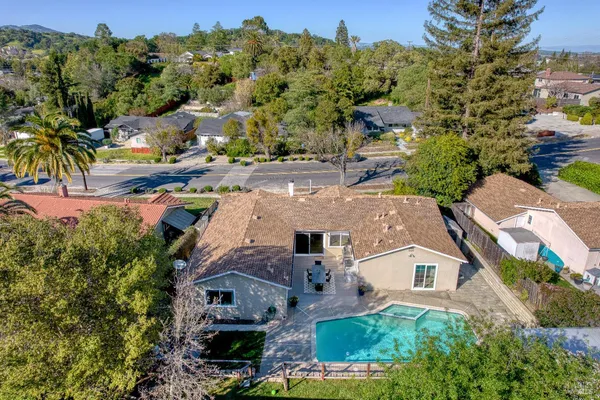 an aerial view of residential houses with outdoor space