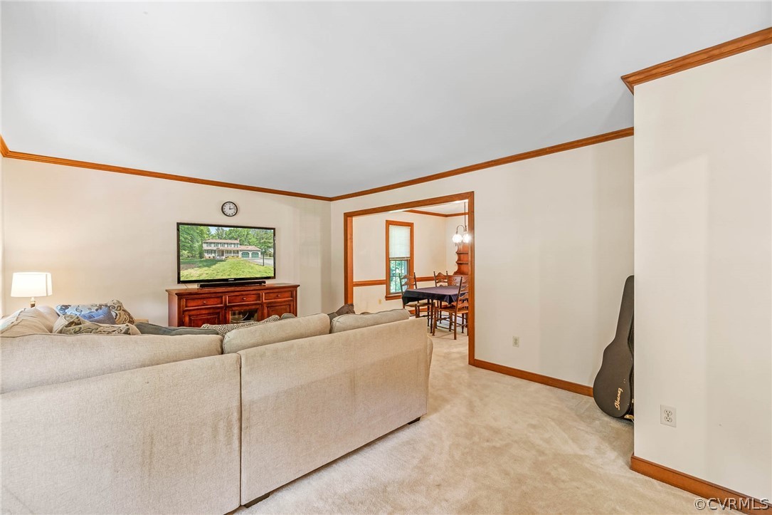 2801 Fairgate Road Midlothian, VA 23112 - Photo 13 of 49 a living room with furniture and a flat screen tv