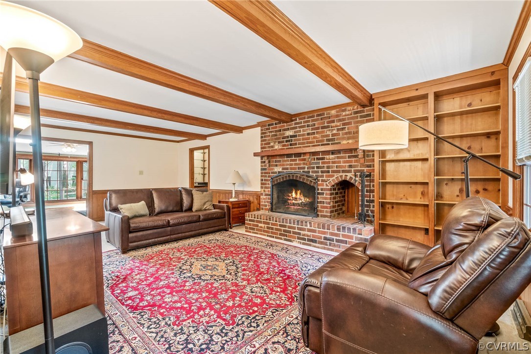 2801 Fairgate Road Midlothian, VA 23112 - Photo 23 of 49 a living room with furniture a rug and a fireplace