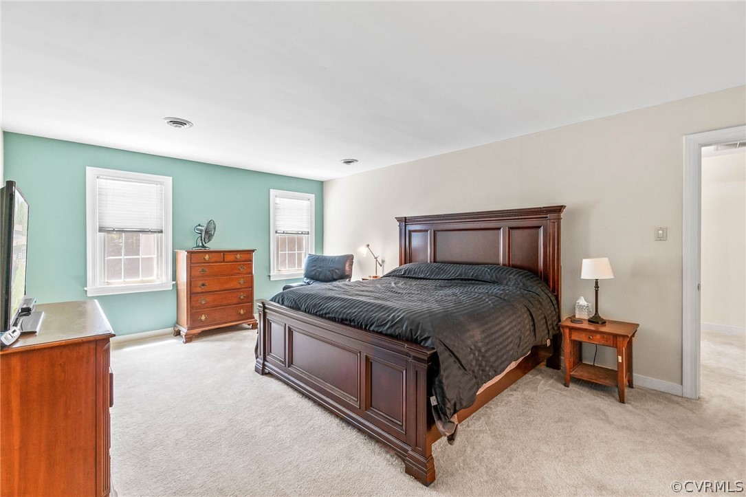 2801 Fairgate Road Midlothian, VA 23112 - Photo 28 of 49 a spacious bedroom with a bed and a flat screen television