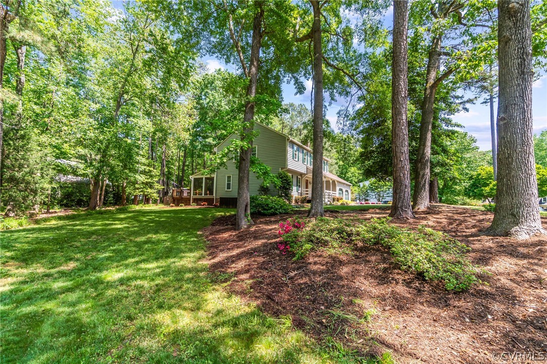 2801 Fairgate Road Midlothian, VA 23112 - Photo 4 of 49 a view of a backyard with large trees