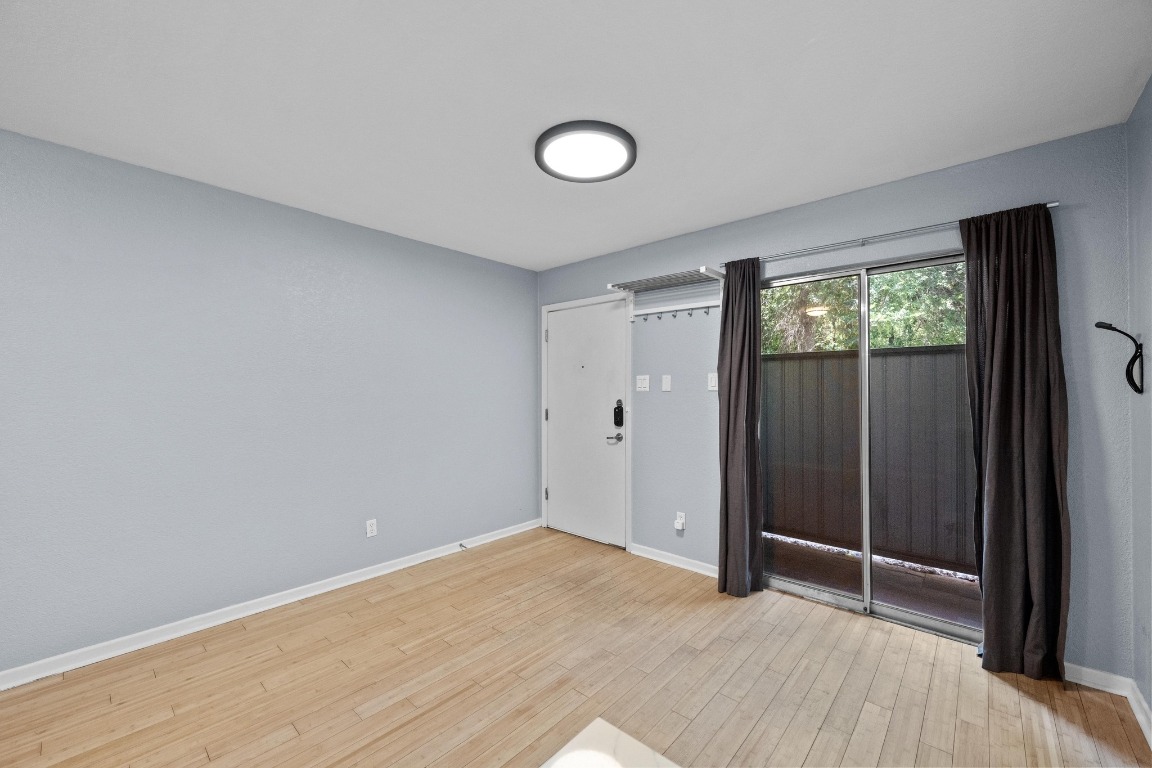 3204 Menchaca Road, Unit 405 Austin, TX 78704 - Photo 5 of 29 an empty room with windows