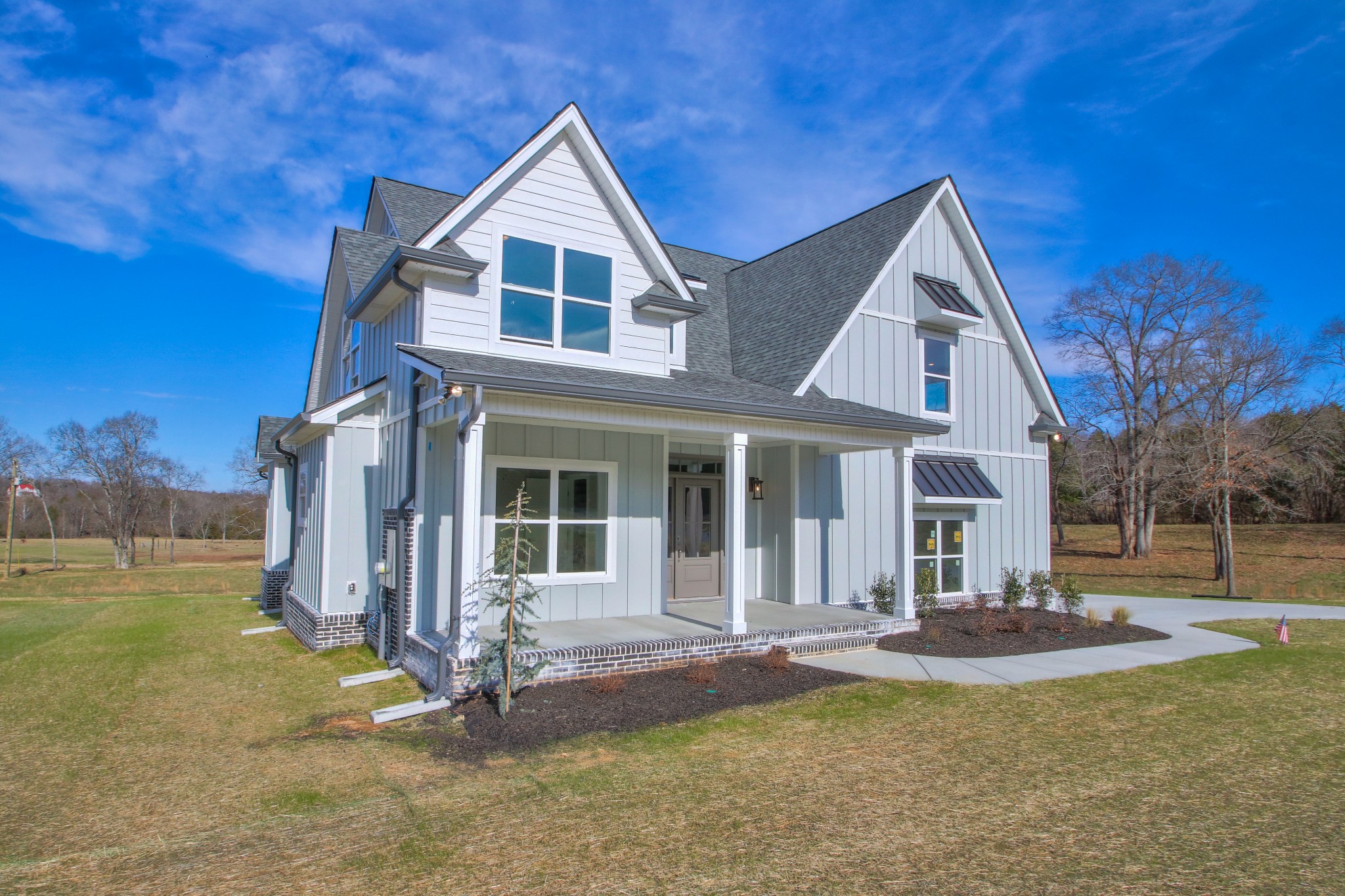 2595 Tracy Road Watertown, TN 37184 - Photo 3 of 45 a front view of a house with a yard table and chairs