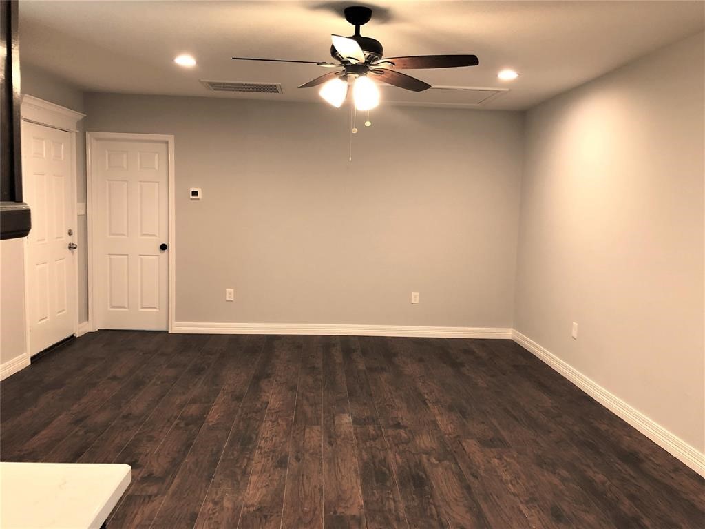 6207 Conley Street Houston, TX 77021 - Photo 5 of 9 an empty room with wooden floor fan and window