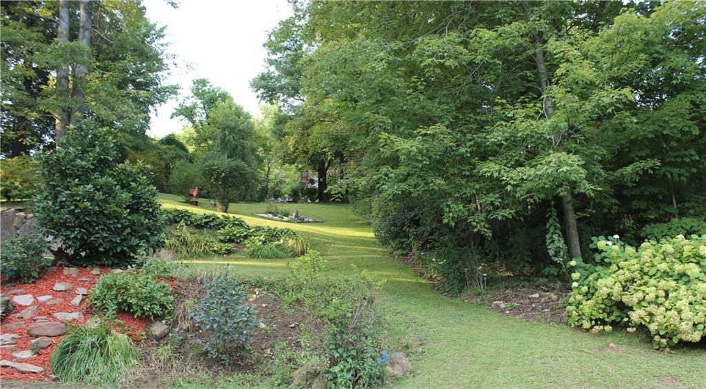 Breathtaking scenic lawns provide a serene atmosphere, spacious living from neighboring homes and lots of shade trees to cool summer days.