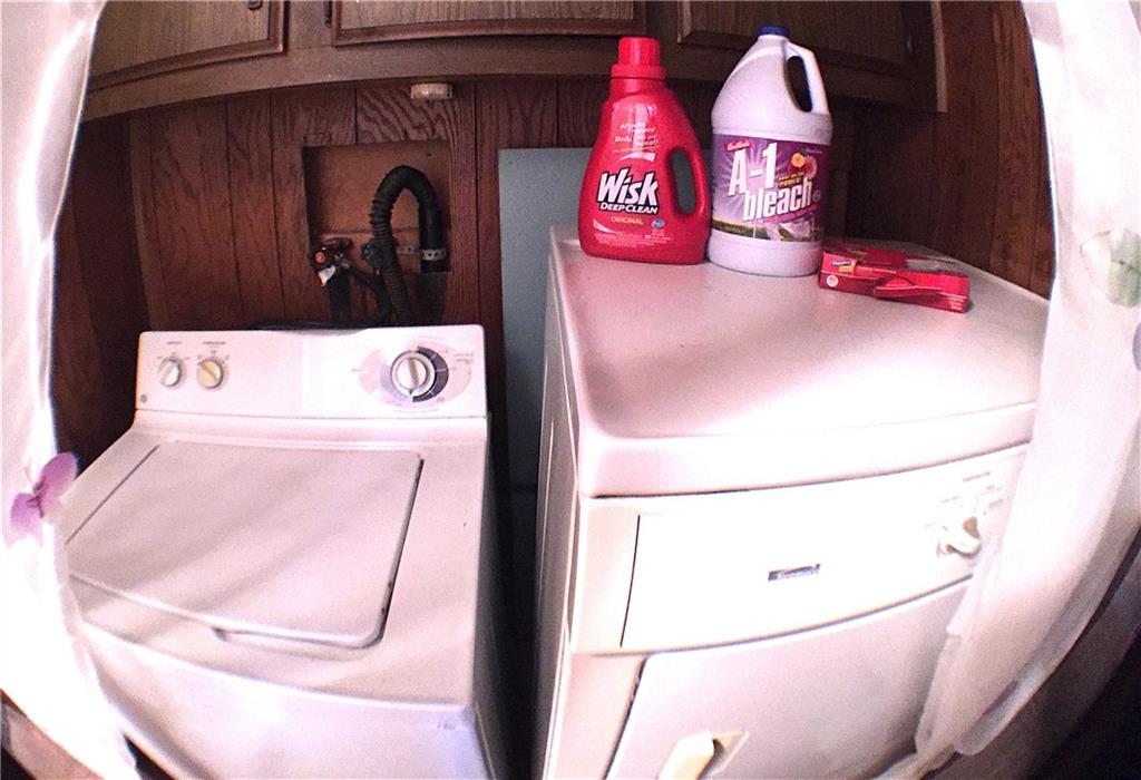 149 Fry Hollow Road Hunker, PA 15639 - Photo 22 of 22 Main floor Laundry Center features convenient access and overhead cabinet storage.