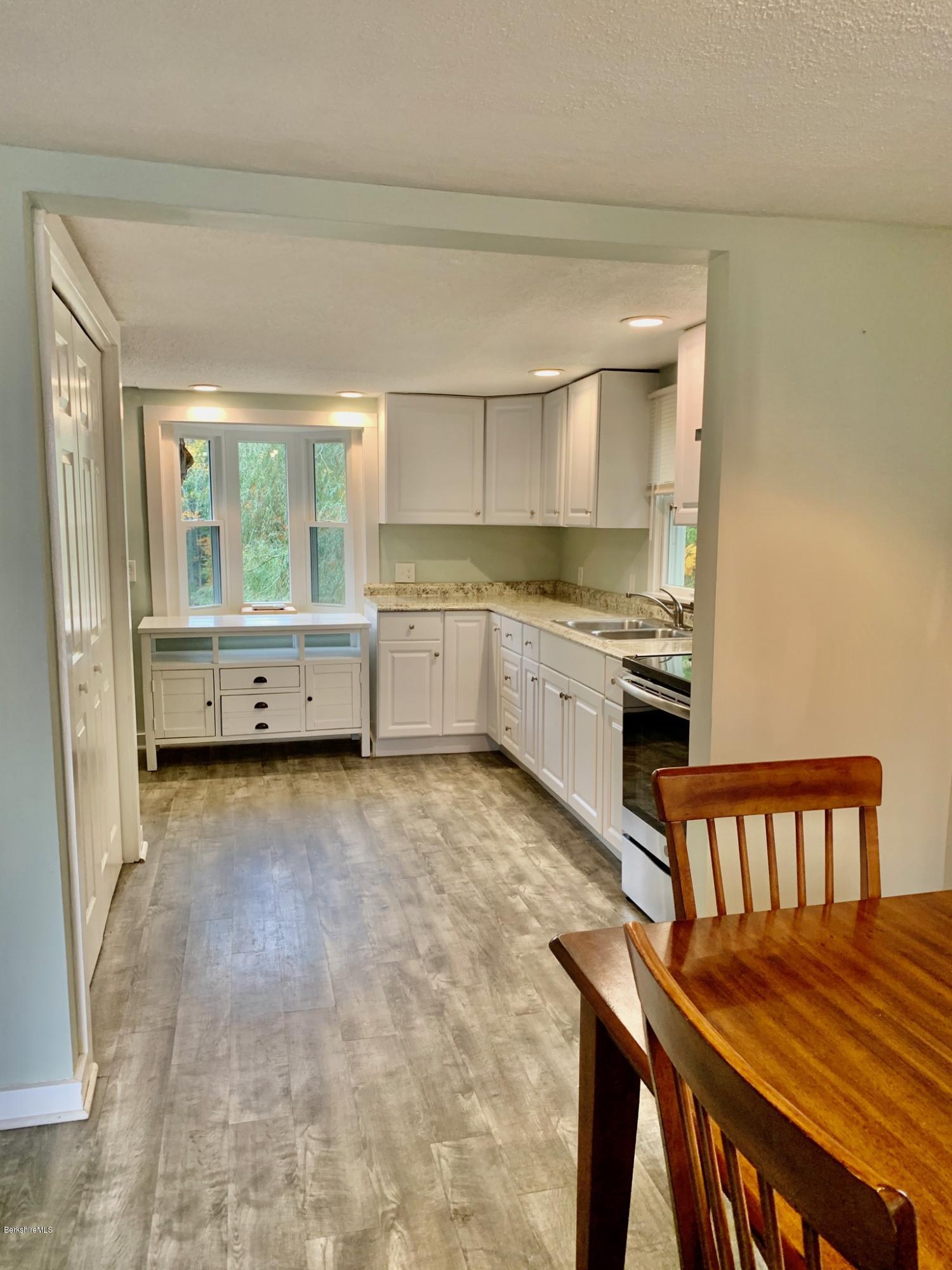 250 Wells Road Becket, MA 01223 - Photo 5 of 34 Dining into kitchen