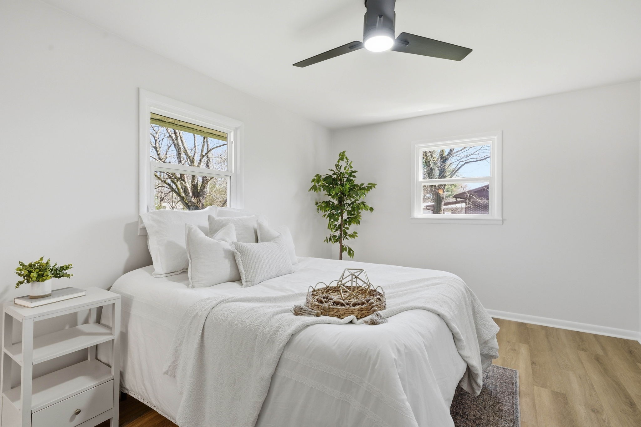 166 Bains Road Hillsboro, TN 37342 - Photo 13 of 37 a bedroom with a large bed and a potted plant