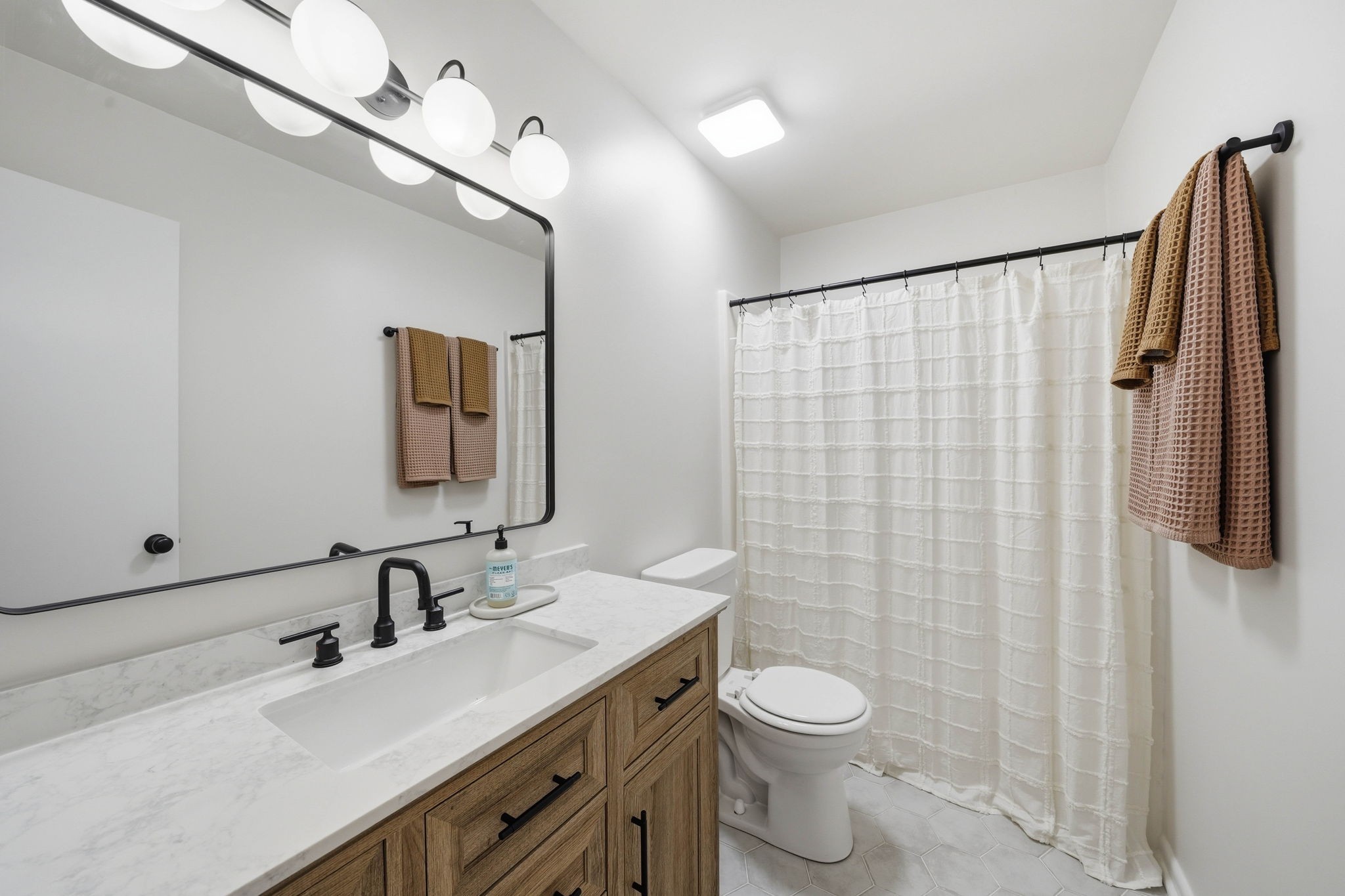 166 Bains Road Hillsboro, TN 37342 - Photo 17 of 37 a bathroom with a granite countertop sink toilet and shower