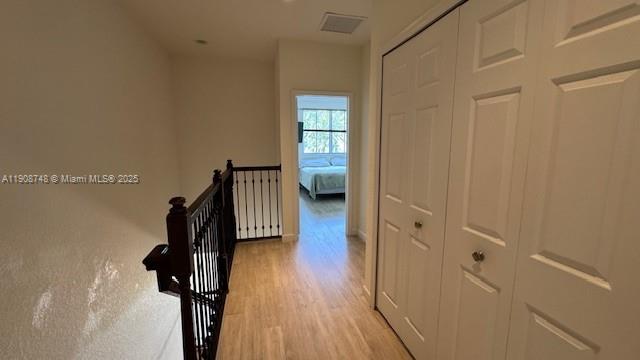 7844 Northwest 114th Path, Unit 7844 Doral, FL 33178 - Photo 15 of 18 a view of a hallway with wooden floor and staircase