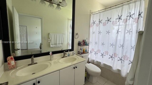 7844 Northwest 114th Path, Unit 7844 Doral, FL 33178 - Photo 18 of 18 a bathroom with a granite countertop sink toilet and shower