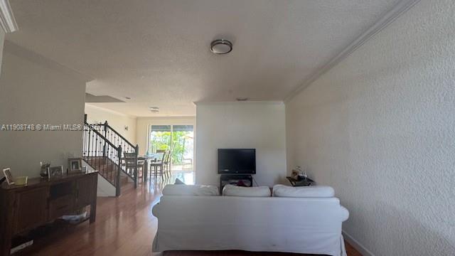 7844 Northwest 114th Path, Unit 7844 Doral, FL 33178 - Photo 3 of 18 a living room with furniture and a flat screen tv