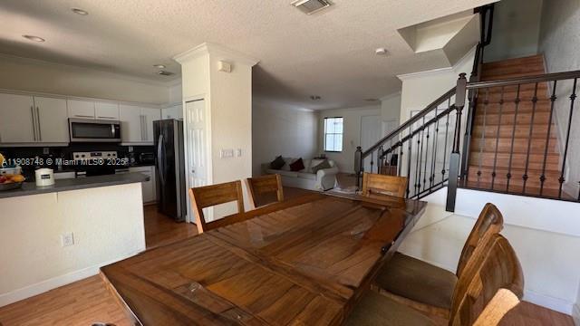 7844 Northwest 114th Path, Unit 7844 Doral, FL 33178 - Photo 4 of 18 a living room with furniture and a wooden floor
