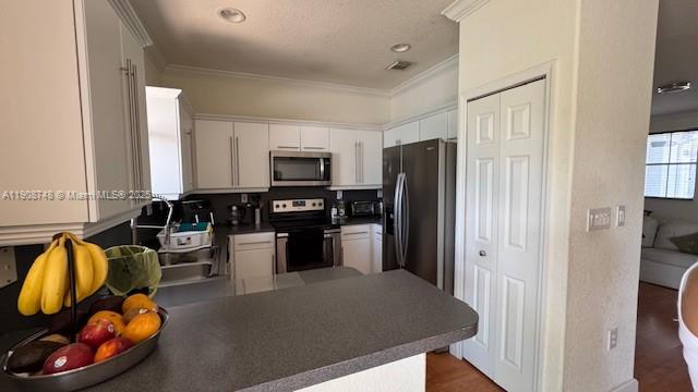 7844 Northwest 114th Path, Unit 7844 Doral, FL 33178 - Photo 6 of 18 a kitchen with stainless steel appliances granite countertop a refrigerator and a stove top oven