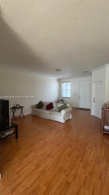 7844 Northwest 114th Path, Unit 7844 Doral, FL 33178 - Photo 8 of 18 a living room with furniture and a flat screen tv