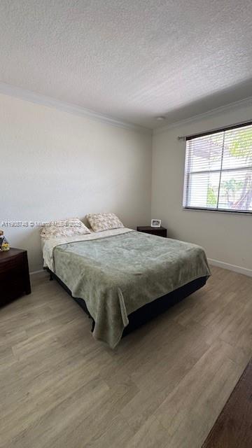 7844 Northwest 114th Path, Unit 7844 Doral, FL 33178 - Photo 10 of 18 a bedroom with a bed and a window