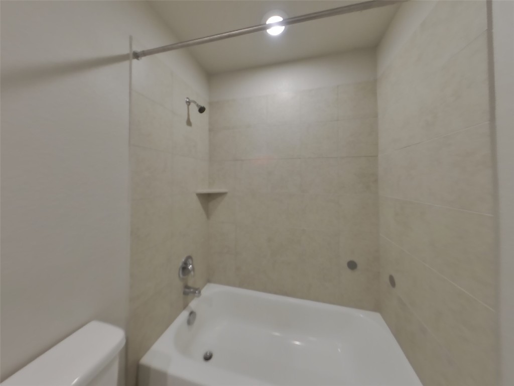 3540 Catlett Crk Road Georgetown, TX 78626 - Photo 11 of 26 a bathroom with a white bath tub and a white door