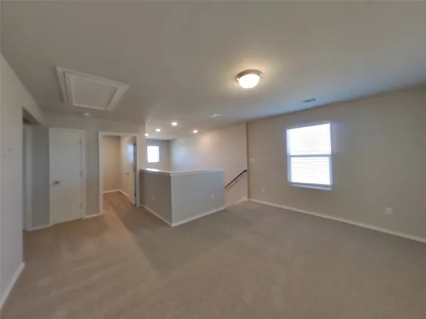 a bathroom with a white bath tub and a white door