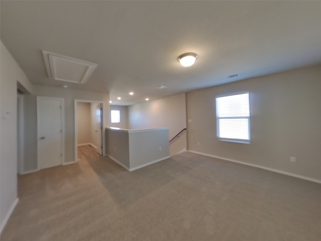 3540 Catlett Crk Road Georgetown, TX 78626 - Photo 12 of 26 an empty room with windows and entrance to other room