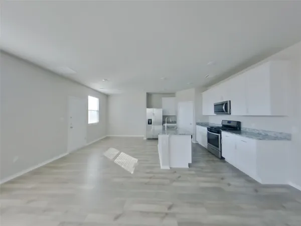 a living room with furniture and window