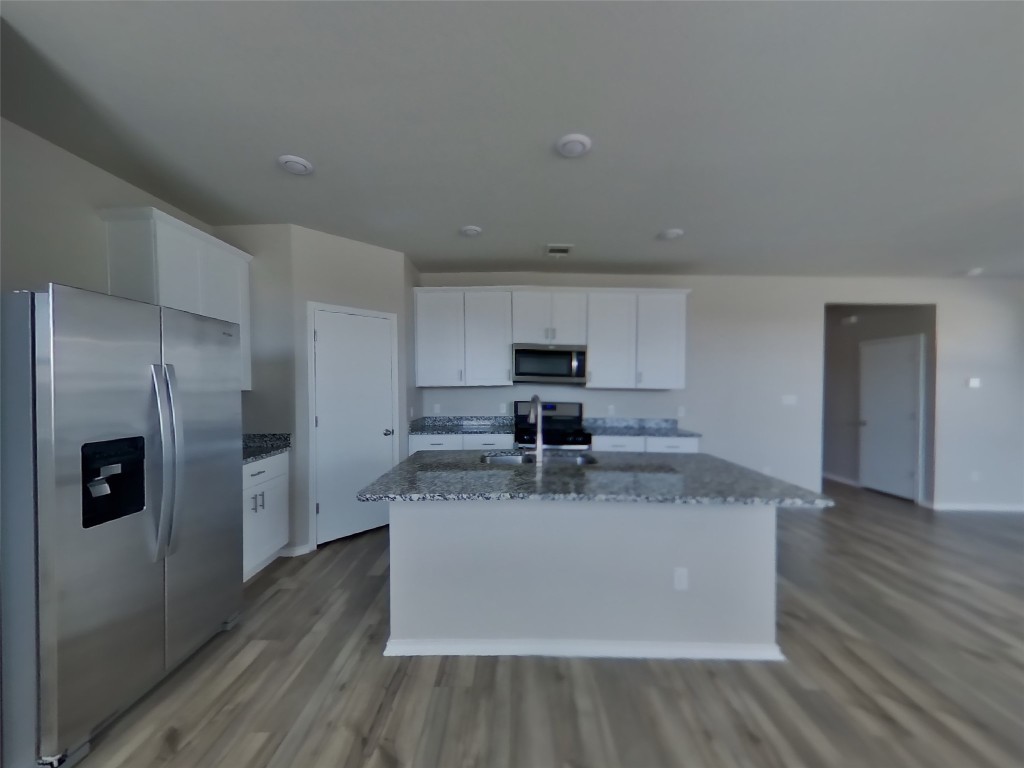 3540 Catlett Crk Road Georgetown, TX 78626 - Photo 4 of 26 a view of a kitchen with stainless steel appliances granite countertop a refrigerator a sink and a stove