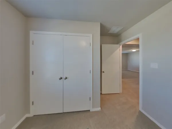 a bathroom with a double vanity sink and shower