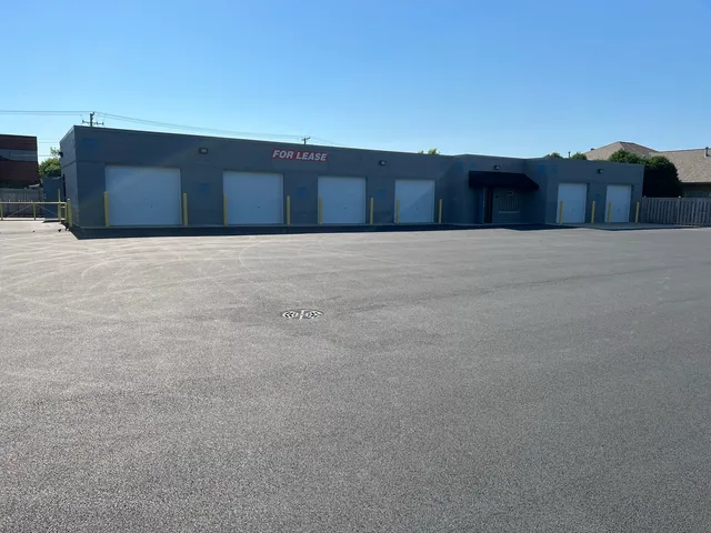 a view of a swimming pool with a patio and backyard of the house