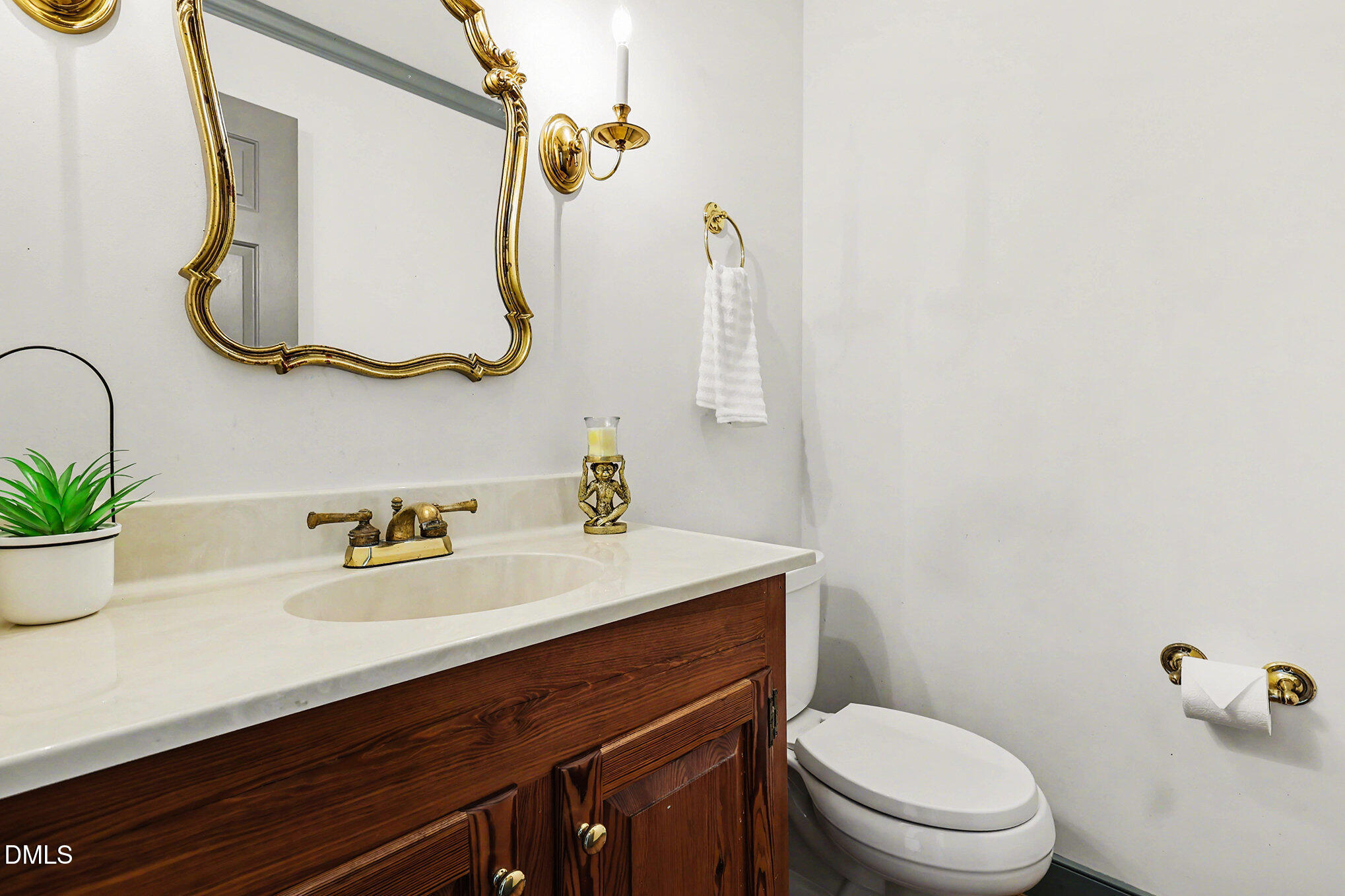 4604 Bartwood Drive Raleigh, NC 27613 - Photo 13 of 38 a bathroom with a sink vanity mirror and toilet