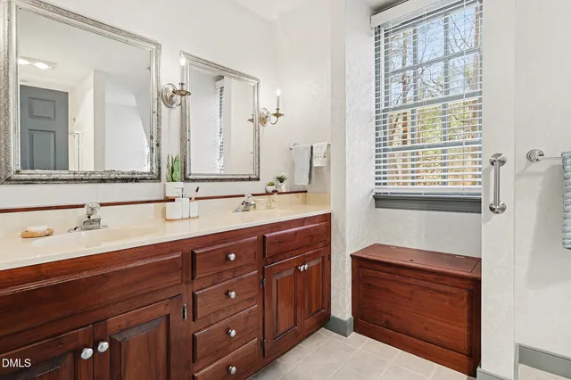 a bathroom with a sink a vanity and a mirror