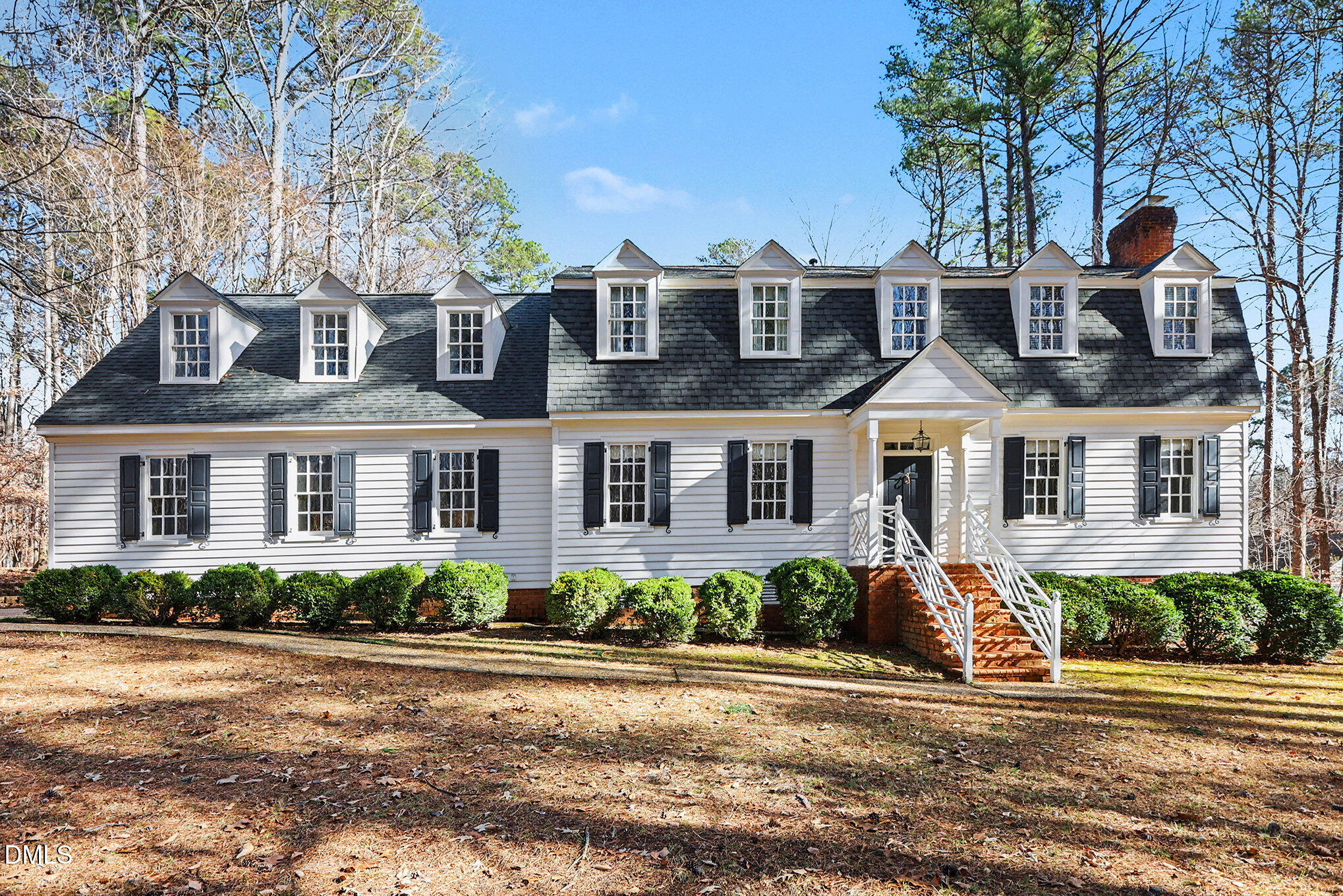 4604 Bartwood Drive Raleigh, NC 27613 - Photo 2 of 38 a front view of a house with a garden