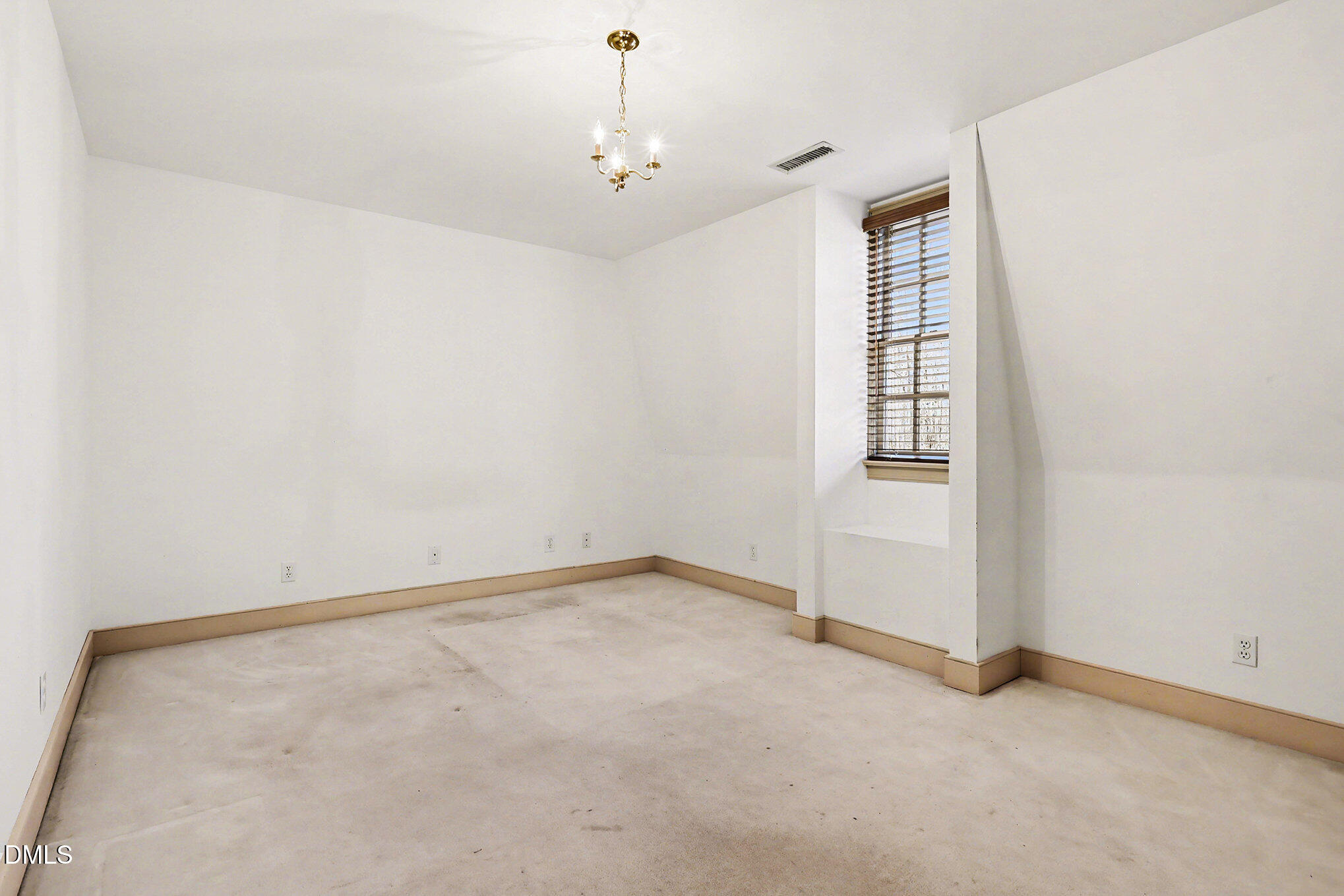4604 Bartwood Drive Raleigh, NC 27613 - Photo 23 of 38 an empty room with windows