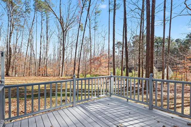 a view of a wooden balcony with outdoor space