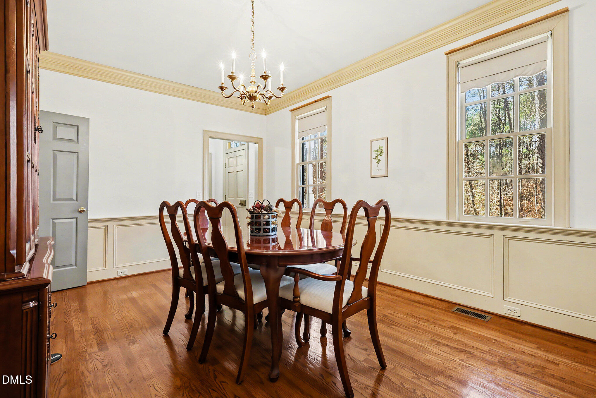 4604 Bartwood Drive Raleigh, NC 27613 - Photo 8 of 38 a view of a dining room with furniture window and wooden floor