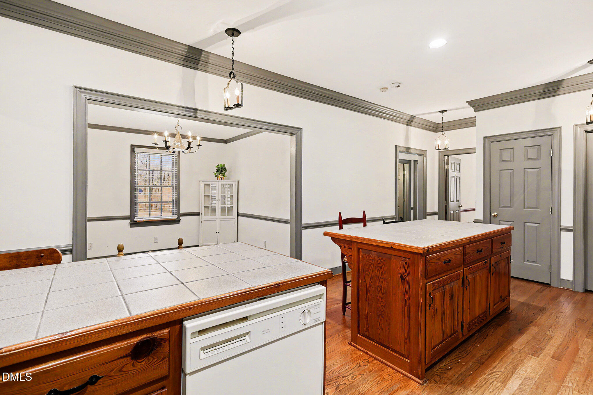 4604 Bartwood Drive Raleigh, NC 27613 - Photo 10 of 38 a kitchen that has a lot of cabinets in it