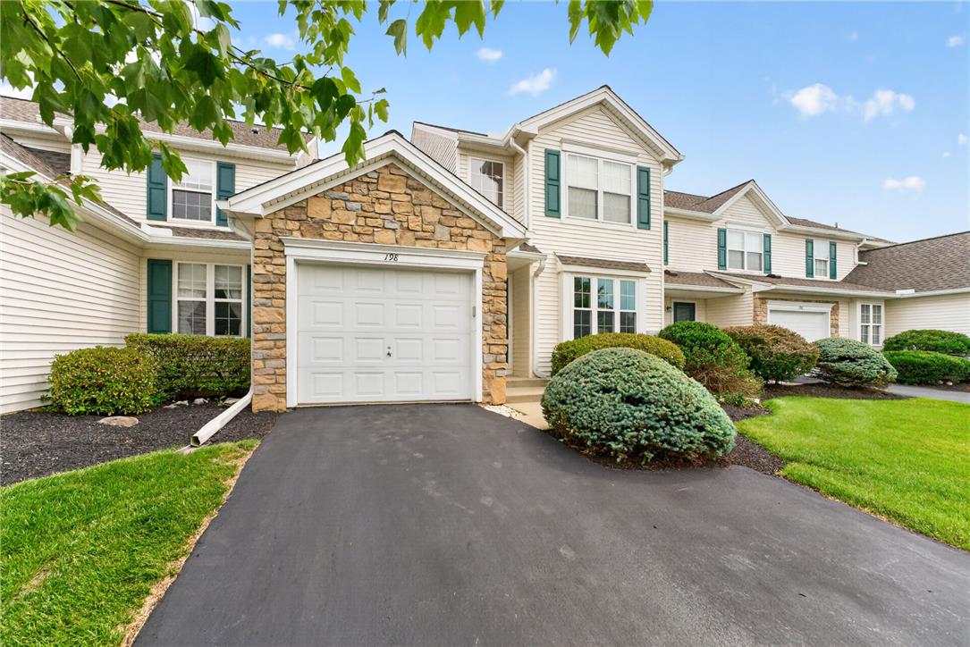 198 Park Ridge Drive Easton, PA 18040 - Photo 25 of 28 Stone accents and manicured shrubs enhance the attractive facade of this suburban home.