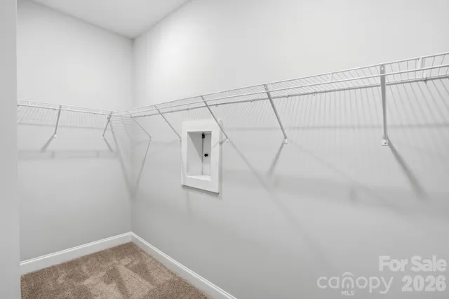 a view of a room with racks on the wall