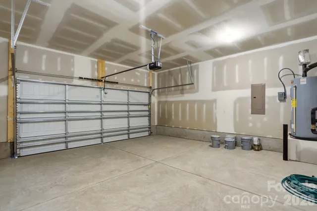 a view of backyard with wooden fence