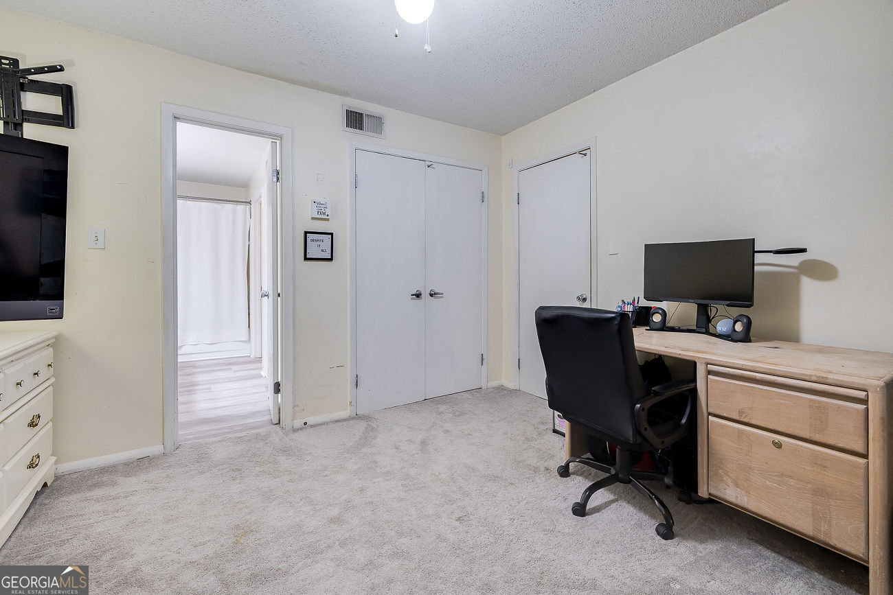 401 North Cromwell Road, Unit Q7 Savannah, GA 31410 - Photo 16 of 21 a view of a workspace with furniture and a window