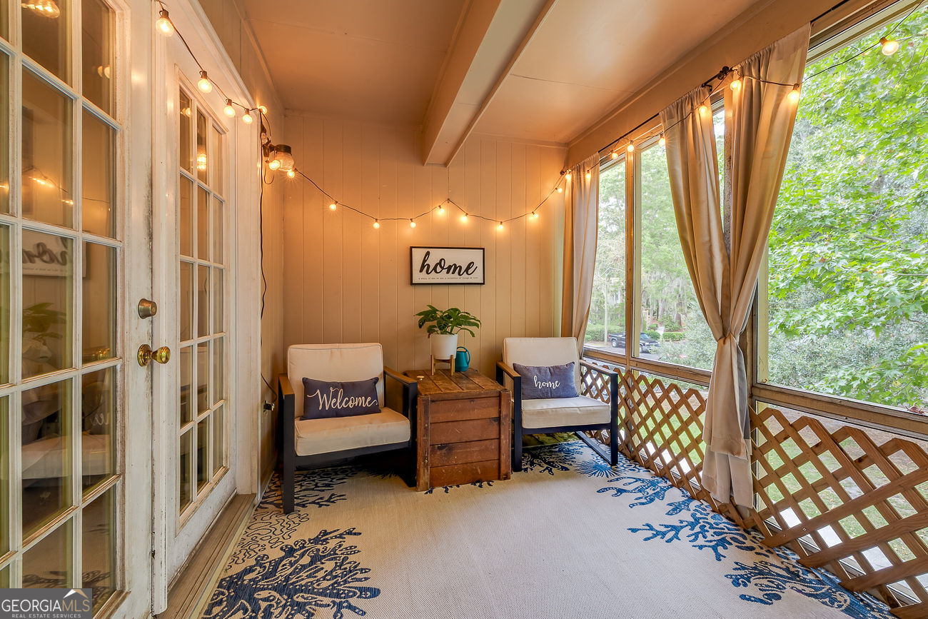 401 North Cromwell Road, Unit Q7 Savannah, GA 31410 - Photo 3 of 21 a bedroom with furniture and large window