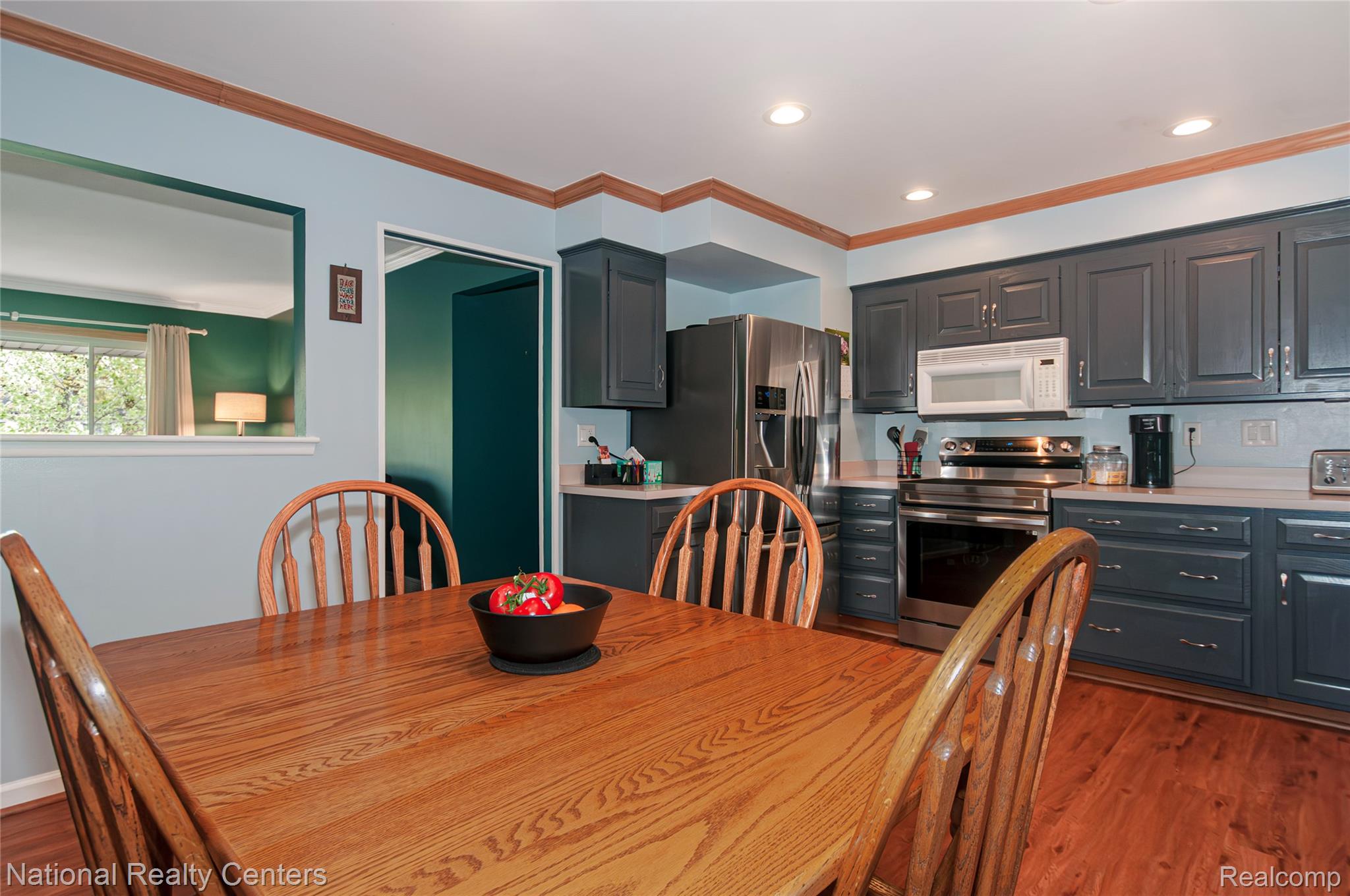 2446 Milverton Road Troy, MI 48083 - Photo 10 of 41 Dining space with crown molding, dark wood-type flooring, and recessed lighting