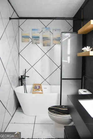 a bathroom with a bathtub and a shower