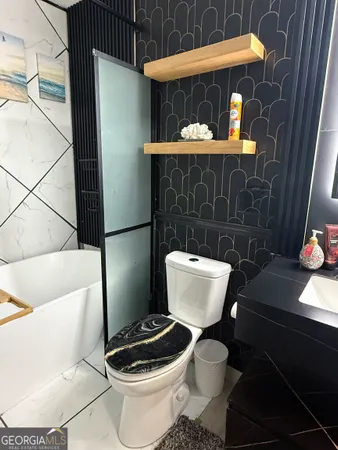a bathroom with a toilet and a sink