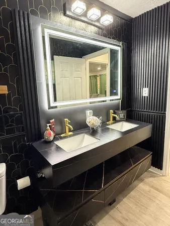 a bathroom with a sink and a mirror