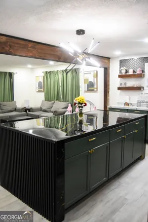 a kitchen with a sink and wooden cabinets