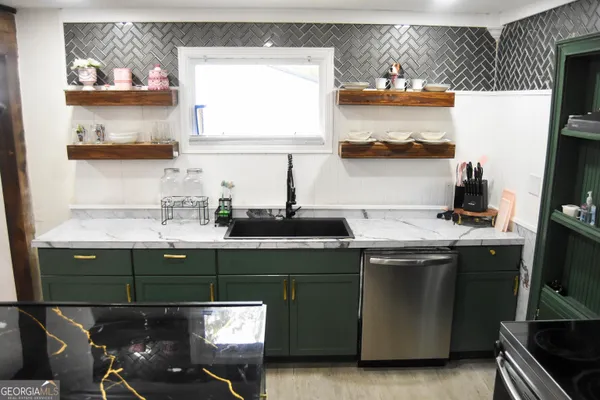 a view of cabinets and wooden floor